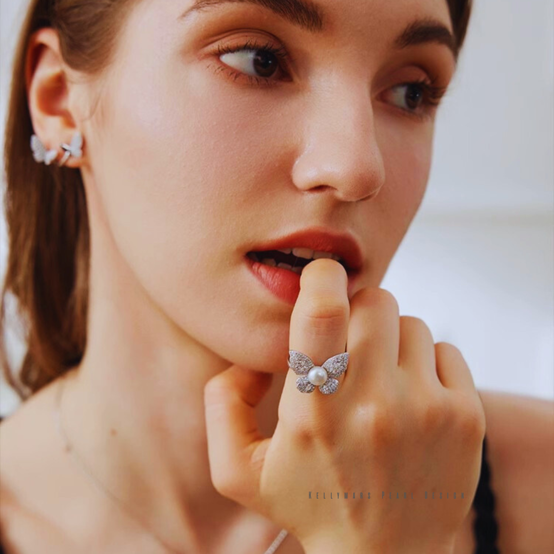 A curated gift box of pearl jewelry: necklace, earrings, ring, and bracelet—elegantly displayed for women over 30.