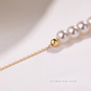 Japanese Akoya pearl tincup necklace paired with a silk blouse for timeless sophistication