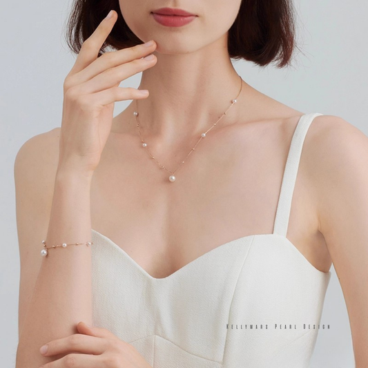 Petite 18K gold Akoya pearl necklace with 5–7.5mm pearls on model’s neck