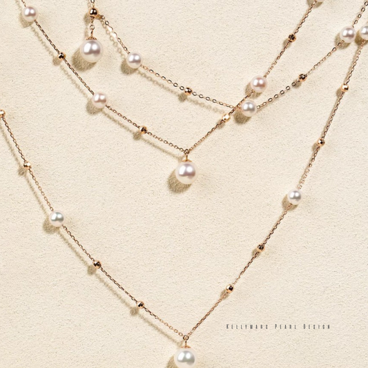 Close-up of Japanese Akoya pearl necklace in solid 18K gold